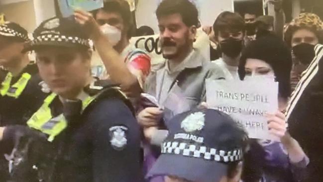 Victoria Police officers had to stand between two groups of protesters inside the City of Monash council building on Wednesday night as tensions flared.