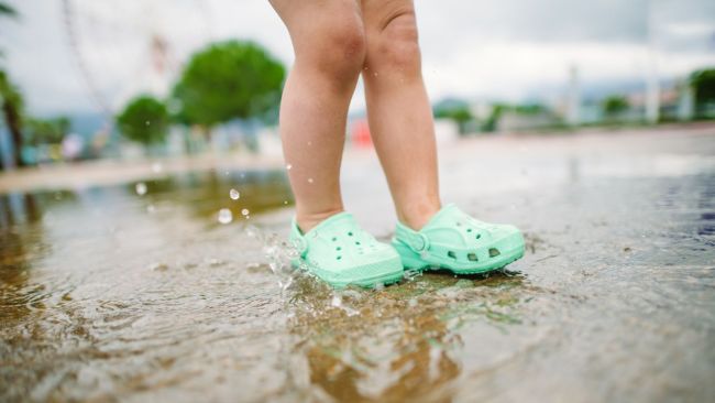 Crocs are convenient for little ones who want to get their feet wet. Image: iStock 