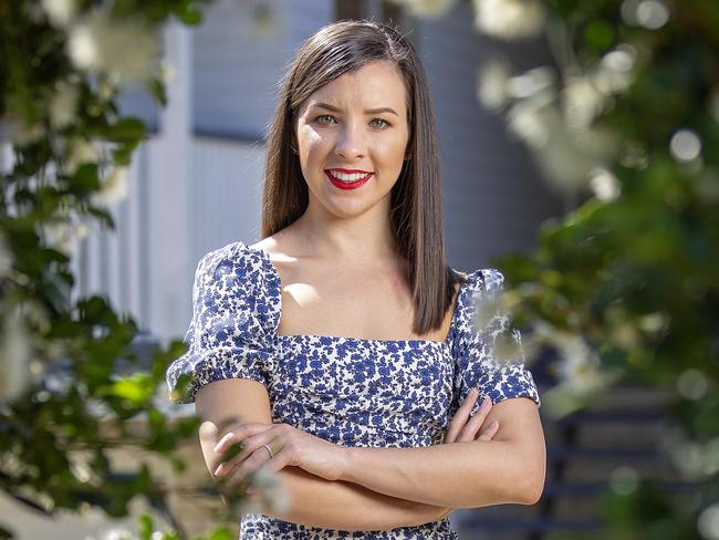 Jess Maude 29 poses for a photograph at home in Arana Hills, Saturday March 21, 2020. She was 23 when she took on care of her half-siblings after her mother passed away.