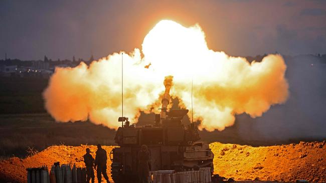 Israeli soldiers fire a 155mm self-propelled howitzer towards the Gaza Strip on May 17. Picture: AFP