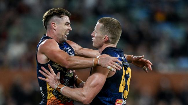 ADELAIDE, AUSTRALIA - MAY 26:   Reilly O'Brien of the Crows   celebrates a goal with   Ben Keays of the Crows during the round 11 AFL match between Kuwarna (the Adelaide Crows) and Waalitj Marawar (the West Coast Eagles) at Adelaide Oval, on May 26, 2024, in Adelaide, Australia. (Photo by Mark Brake/Getty Images)