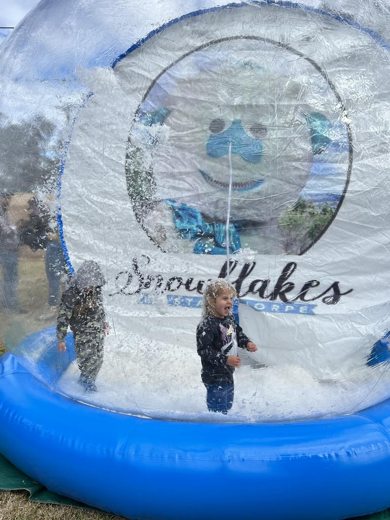 Obie (L) and Spencer (R) playing inside the inflatable snow globes at Snowflakes in Stanthorpe on Saturday, July 1 2023.