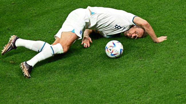 England's forward #09 Harry Kane eyes the ball