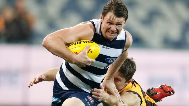 Milestone man Patrick Dangerfield bursts away from Liam Shiels.