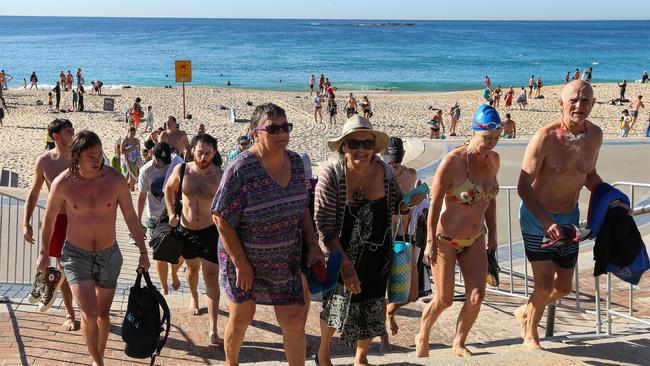 Beachgoers forced to leave Coogee Beach on Anzac Day in Sydney. Picture: Gaye Gerard