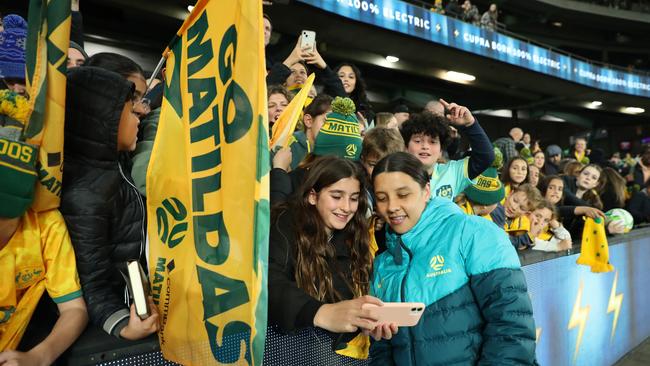 Sam Kerr takes photos with the sellout crowd at Marvel Stadium. Picture: Mackenzie Sweetnam/Getty Images