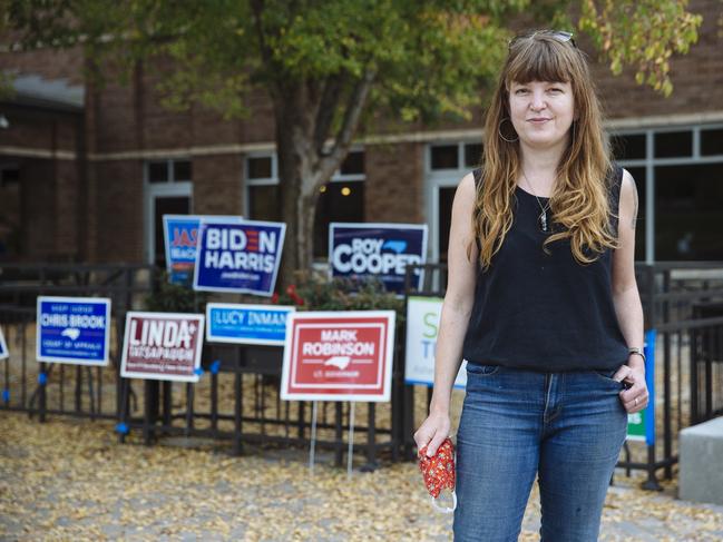 Legal assistant Liz Allen casts her vote for Joe Biden at the University of North Carolina. Picture: Angus Mordant