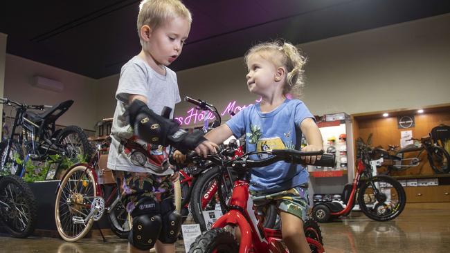 Five-year-old Clarke Williams and three-year-old sister Dillyn inspect the e-bikes at Urban Wheelz. Picture: Brian Cassey