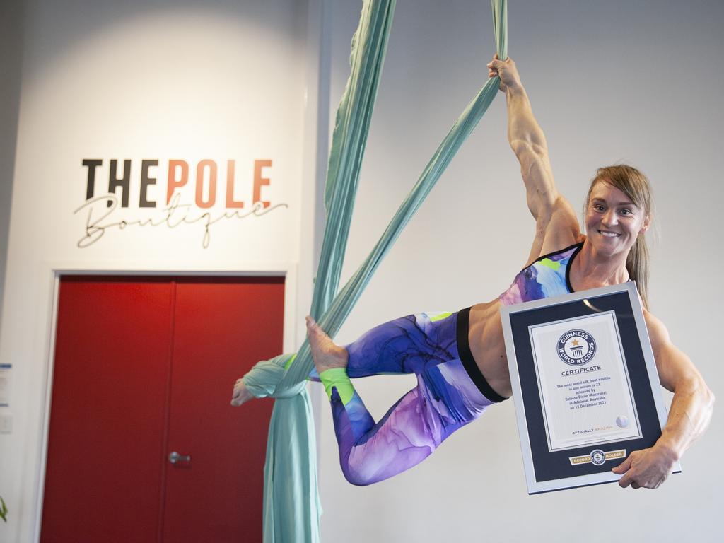 Adelaide’s Celeste Dixon may not appear in Gavin Freeman’s new book How the Ordinary Become Extraordinary, but she has set a Guinness World Record for the most aerial silk front saltos in one minute. Picture: Guinness World Records