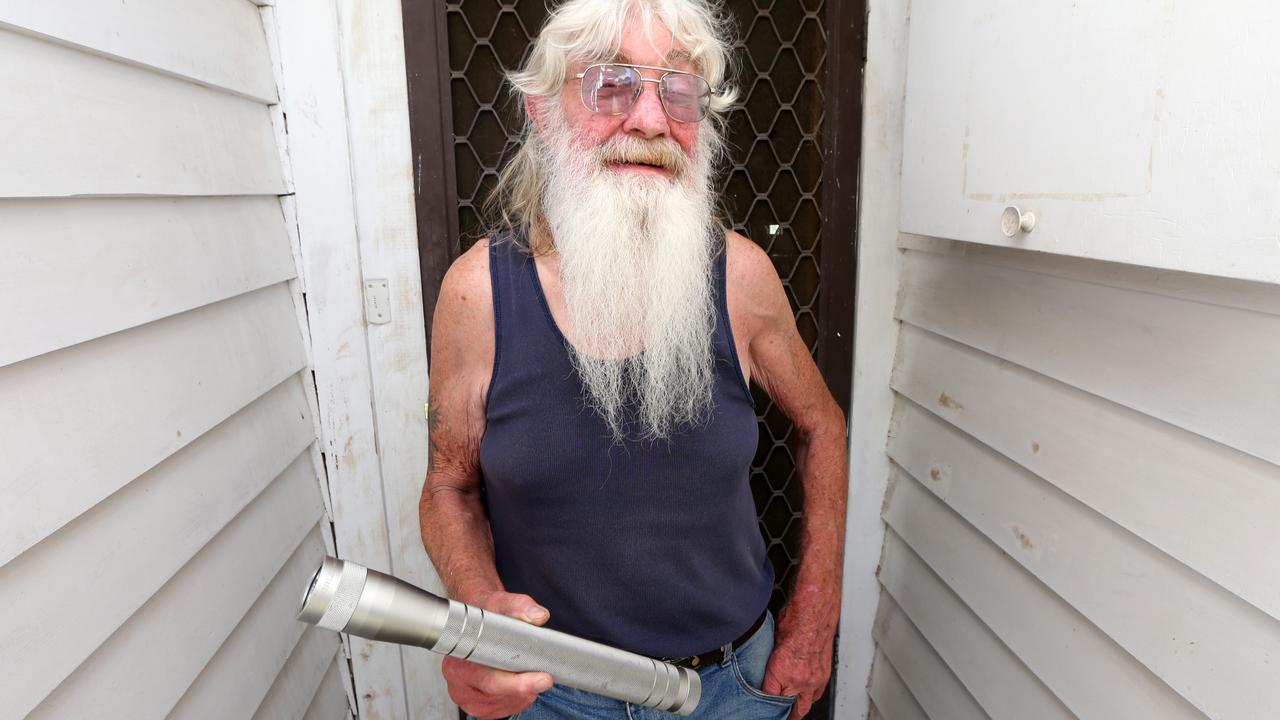 Gary holding the torch he used to threaten the man that car jacked his car in Iona Street Norlane last Friday. Picture: Mike Dugdale