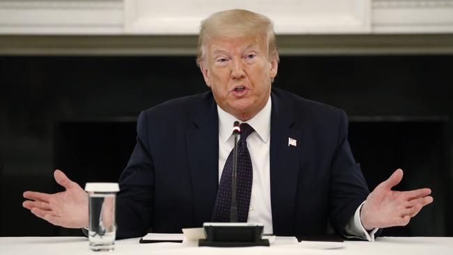 President Donald Trump speaks during a roundtable discussion with law enforcement officials on Monday, in the State Dining Room of the White House in Washington.