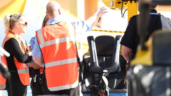 Police and SafeWork SA inspectors look at the seat where Adelene died at 12.14pm. Picture: Tait Schmaal.