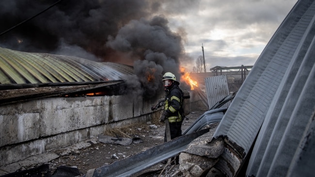 Firefighters try to extinguish a fire after a chemical warehouse was hit by Russian shelling on the eastern frontline near Kalynivka village. Picture: Getty Images