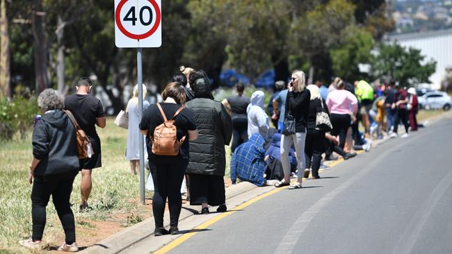 A long queue is seen outside Parafield Gardens testing clinic in Adelaide, South Australia. Picture: NCA NewsWire / David Mariuz