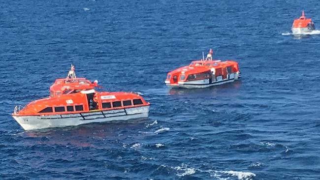 Dozens of Australian passengers on board the Columbus cruise ship abandoned the vessel in life rafts to make a dash for home.