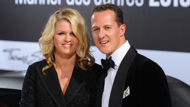 Michael Schumacher and his wife Corinna. AFP PHOTO / JENS KALAENE.