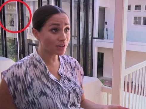 Eagle-eyed fans noticed Harry cradling Archie in the background as Meghan spoke to a reporter in the documentary. Picture: ITV