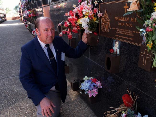 Ken Chapman at the grave of murdered Labor MP John P. Newman on the first anniversary of his death.