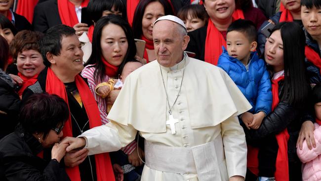 Pope Francis greets faithful from China as he arrives for his weekly general audience in St. Peter's Square in the Vatican in 2018.