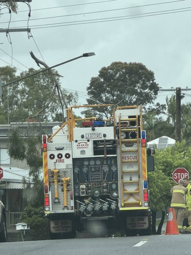 QFES crews removing fallen branch from powerline in Southport. Picture: Brooke Patterson/Facebook