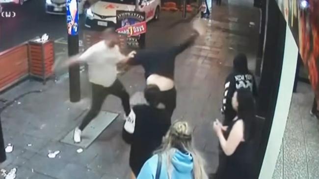 Mr Sansbury-Weetra (white T-shirt) outside Falafel House in Hindley Street. Picture: 7NEWS Adelaide