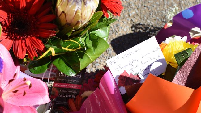 Flowers for a police hero outside Toowoomba police station. Picture: Sarah Motherwell/AAP