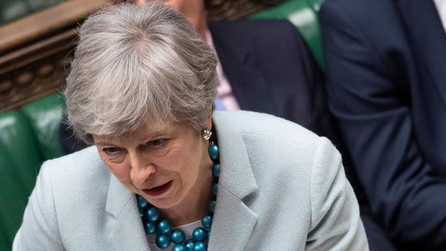 A handout photograph released by the UK Parliament shows Britain's Prime Minister Theresa May answering a question in the House of Commons in London on March 25, 2019 on the next steps that parliament will take in the Brexit process. - Prime Minister Theresa May admitted Monday she had still not secured the votes needed to get her Brexit deal through parliament, raising again the prospect that Britain could crash out of the European Union in two weeks' time. (Photo by Jessica TAYLOR / UK PARLIAMENT / AFP) / RESTRICTED TO EDITORIAL USE - NO USE FOR ENTERTAINMENT, SATIRICAL, ADVERTISING PURPOSES - MANDATORY CREDIT " AFP PHOTO /JESSICA TAYLOR/ UK Parliament"