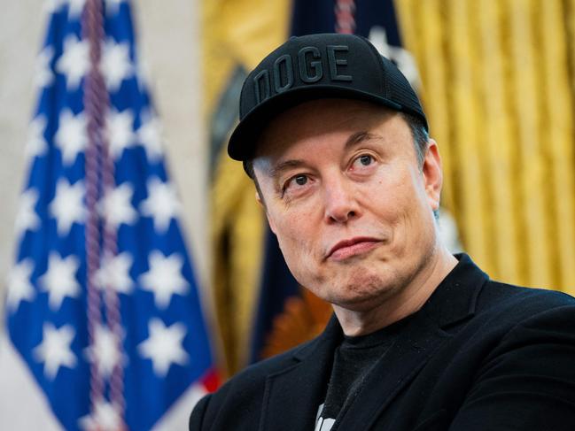 Elon Musk looks on during a news conference with US President Donald Trump in the Oval Office of the White House in Washington, DC, on May 30, 2025. Musk, who stormed into US politics as President Trump's chainsaw-brandishing sidekick, announced on May 28 that he is leaving his role in US government, intended to reduce federal spending, shortly after his first major break with the President over Trump's signature spending bill. (Photo by Allison ROBBERT / AFP)