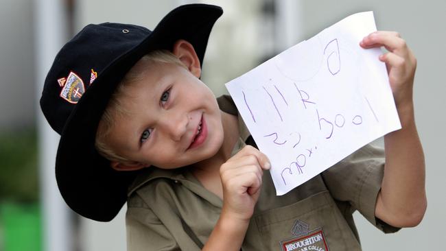 5 year old Max Rivett who was a very teary boy at the start of his first day at school happily greets mum Kristy Rivett after a good day in the classroom at Broughton Anglican School.