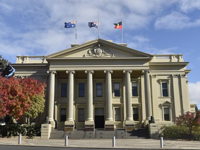 Flags flying half mast at City Hall. Marchers took part in an Anzac Parade through Malop Street to Johnstone Park on Anzac Day. Crowds lined the street but there were none of the usual formalities at the finale. Picture: Alan Barber