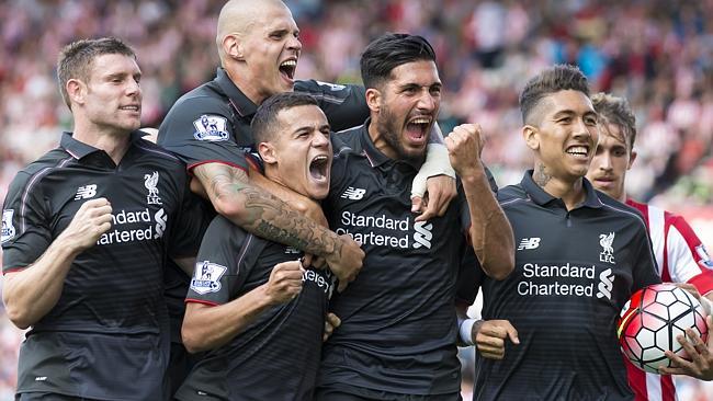 Liverpool's Philippe Coutinho, lower centre left, celebrates with teammates.