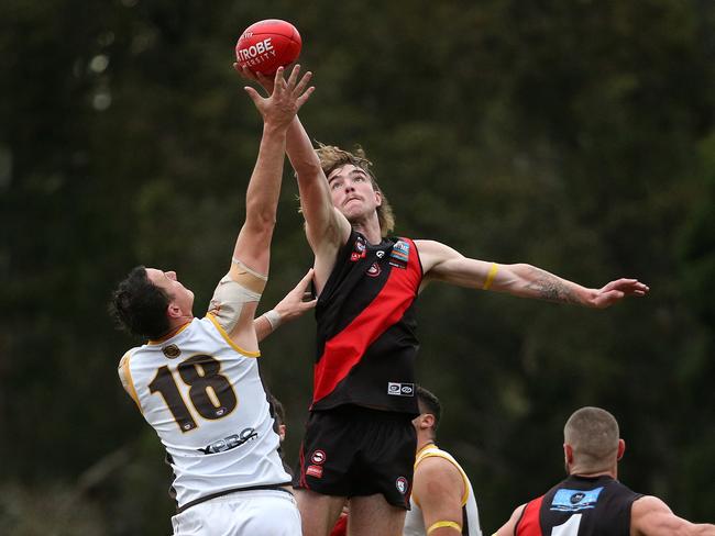 NFL: Eltham v Thomastown: Finnbar Maley of Eltham (R) contest ruck against Jarryd Coulson of Thomastown on Saturday May 14, 2022, in Eltham, Australia.Picture: Hamish Blair