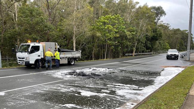 A Sunshine Coast Council crew mops up following a crash at Sippy Downs this morning, August 22. Picture: Craig Wilson