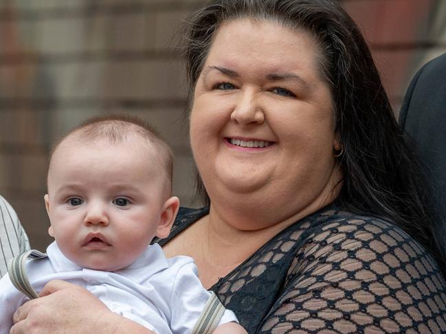 ADELAIDE, AUSTRALIA - NewsWire Photos March 14, 2024: Belinda Nuske, holding baby Emmett, with husband Keiron Nuske (right) and Helina Michalski (left) who was the surrogate mother. They attended family court to make Emmett legally BelindaÃs after going through surrogacy to have him. Picture: NCA NewsWire / Naomi Jellicoe