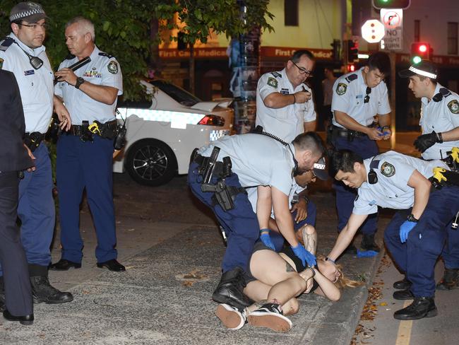 Ms Amati on the street in Enmore following the attack inside the 7 Eleven. Picture: Gordon McComiskie