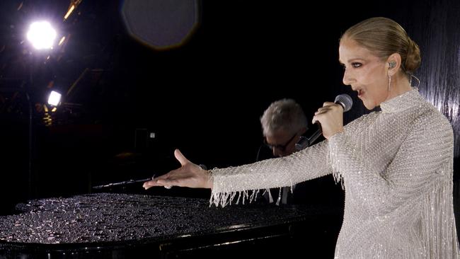 PARIS, FRANCE - JULY 26: (EDITOR'S NOTE: This Handout screengrab was provided by a third-party organisation and may not adhere to Getty Images' editorial policy.) This handout released by the Olympic Broadcasting Services, shows a view of singer Celine Dion performing on the Eiffel Tower during the opening ceremony of the Paris 2024 Olympic Games Paris 2024 on July 26, 2024 in Paris, France. (Screengrab by IOC via Getty Images)