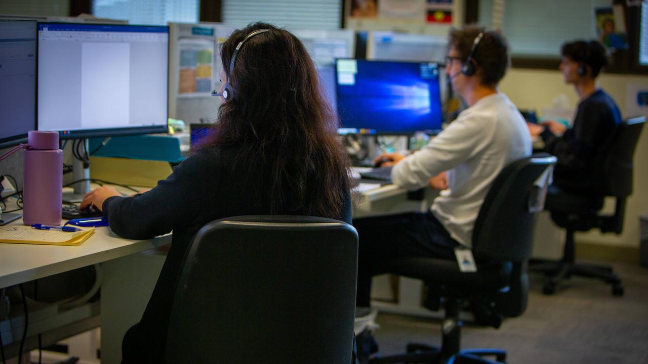 Staff working at the Child Abuse Report Line call centre. Picture: NCA Newswire/Emma Brasier