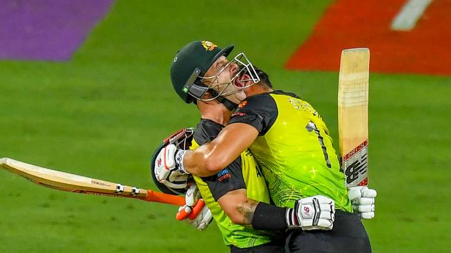 Matthew Wade and Marcus Stoinis celebrate Australia’s victory. Picture: AFP