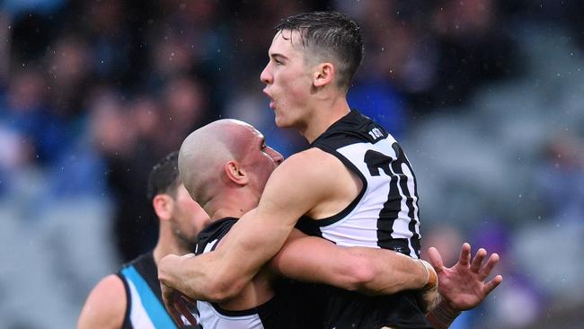 Connor Rozee celebrates one of his goals which helped inspire a youthful Port Adelaide to victory against Gold Coast. Picture: AAP Image/David Mariuz.