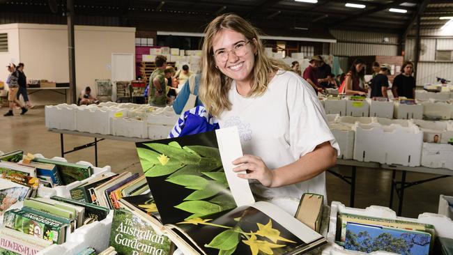 Belle Clark checks out The Chronicle Lifeline Bookfest after recently relocating to the city, Saturday, March 1, 2025. Picture: Kevin Farmer