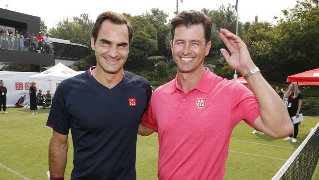 Tennis superstar Roger Federer and Aussie golf star Adam Scott UNI QLO at Royal South Yarra Tennis Club. Picture: David Caird