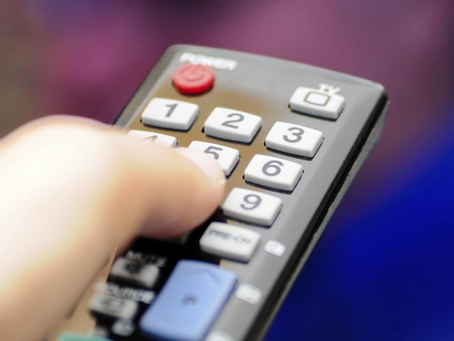 Hand with tv remote control