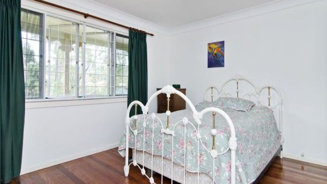 BEFORE: The master bedroom in the house at 26 Gracemere St, Newmarket, before it was renovated.