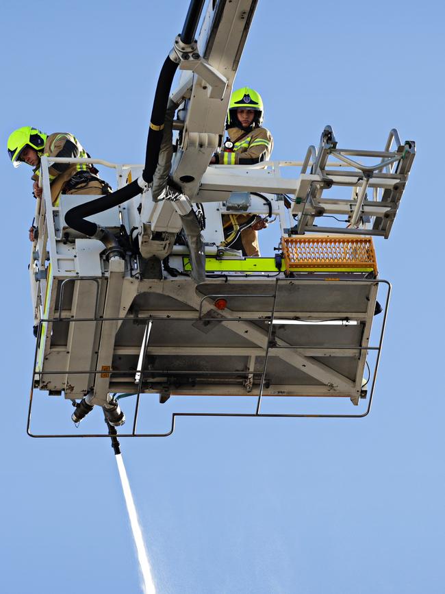 Firefighting work from above on Sunday. Picture: Adam Yip