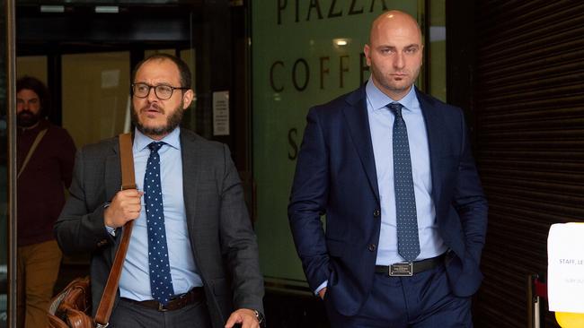 Nadir Zreika (right) leaving the Downing Centre with his lawyer last year. He is the cousin of Hassan Zreika, who had an affair with a prison guard. Picture: Bianca De Marchi