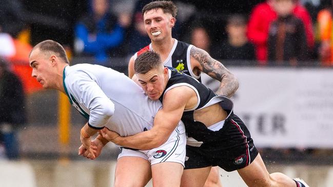 Daniel Annetta sticks the tackle for Watsonia. Picture: Field of View Photography