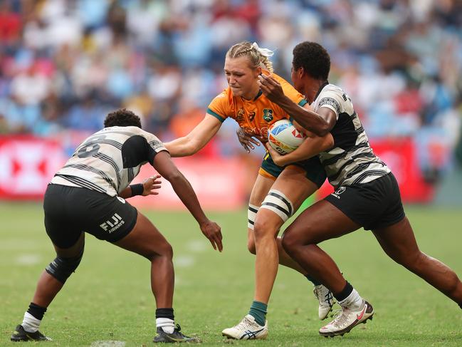 SYDNEY, AUSTRALIA – JANUARY 29: Maddison Levi of Australia is tackled during the 2023 Sydney Sevens match between Australia and Fiji at Allianz Stadium on January 29, 2023 in Sydney, Australia. (Photo by Mark Metcalfe/Getty Images)