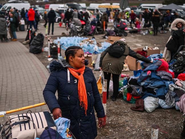 A woman looks for clothes at an aid point with donations at the Polish Ukrainian crossing. Picture: Omar Marques/Getty Images