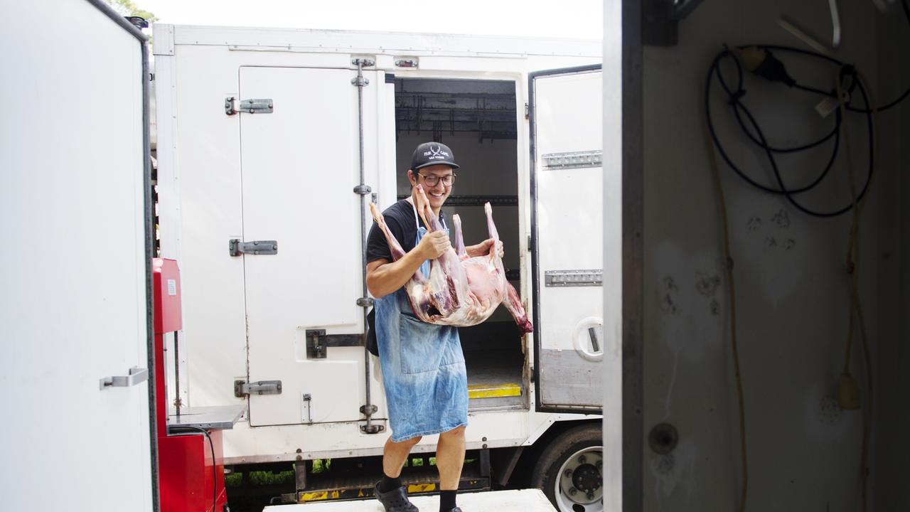 Jonas moving a deer carcass from the truck to the processing room. Picture: Elise Derwin