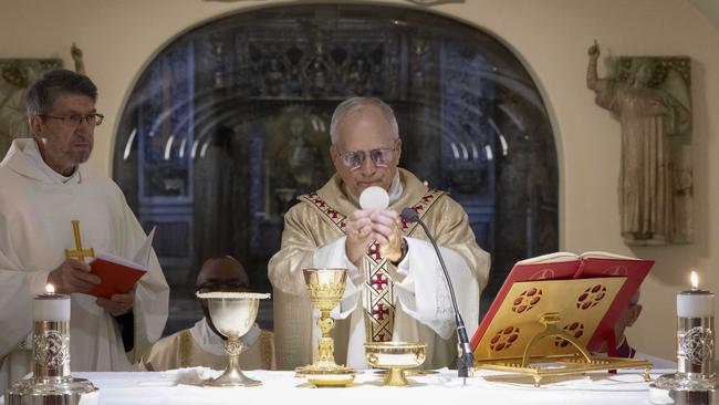 Pope Leo XIV celebrates Mass in the Vatican Grotto, underneath St Peter's Basilica, on Sunday. Picture: Vatican Media via AP